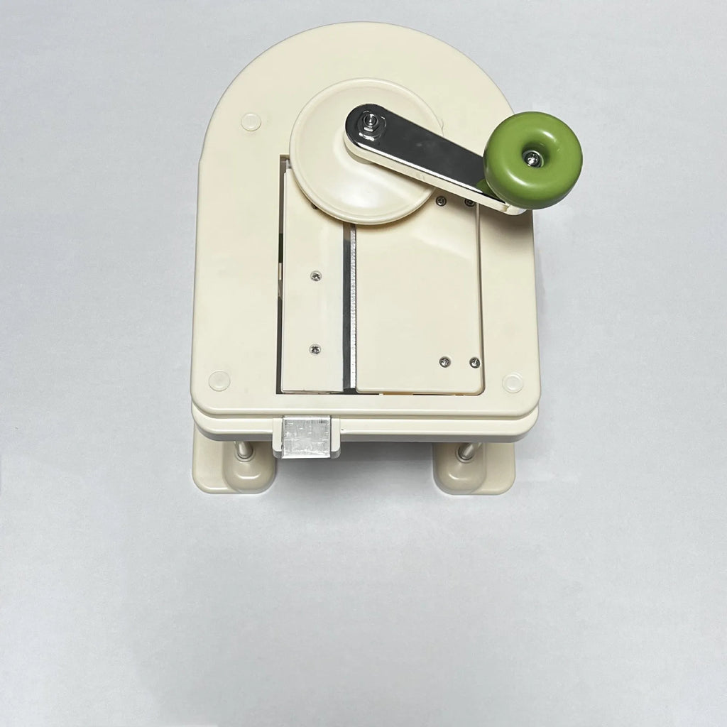 Beige kitchen slicer chopper with stainless steel blades for vegetable preparation