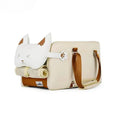 Beige hard-shell pet flight case with one-shoulder strap for cats and small dogs