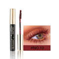 Colourful mascara tubes showing shades like wine red, gold, purple, and black for thick curl Christmas and stage makeup.