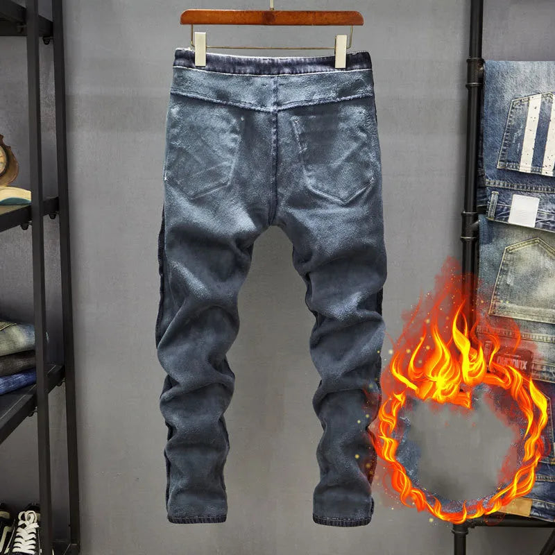 Men's slim-fit skinny jeans in dark blue denim laid flat, showing front design and button fly.
