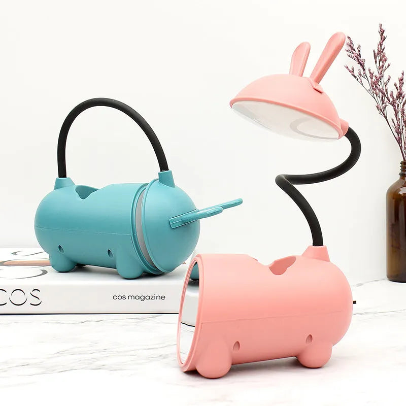 Cartoon style USB-powered desk lamp with pen storage compartment in dark blue colour