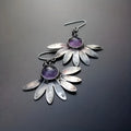 Purple resin bohemian earrings with animal zodiac design and floral elements on alloy settings