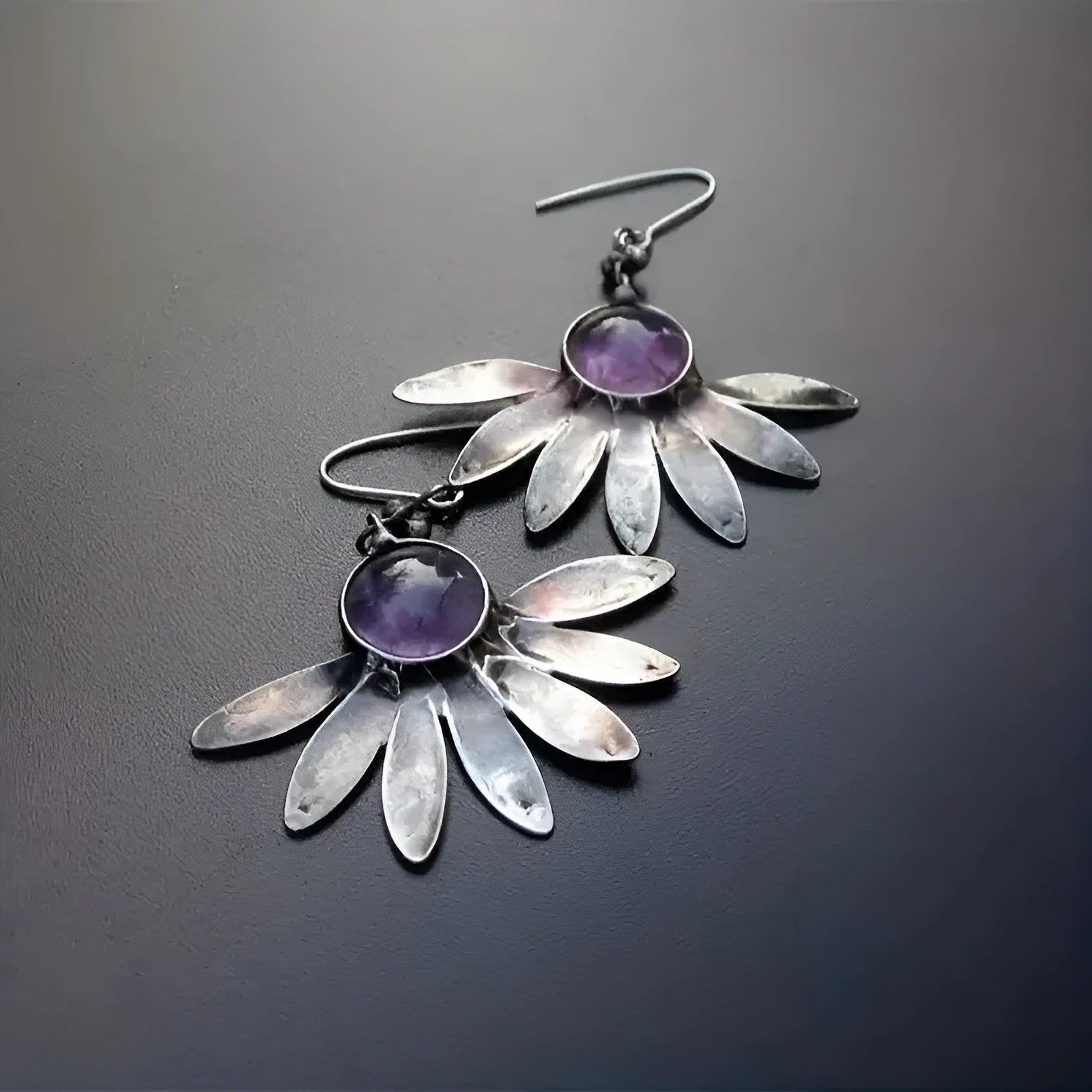 Purple resin bohemian earrings with animal zodiac design and floral elements on alloy settings