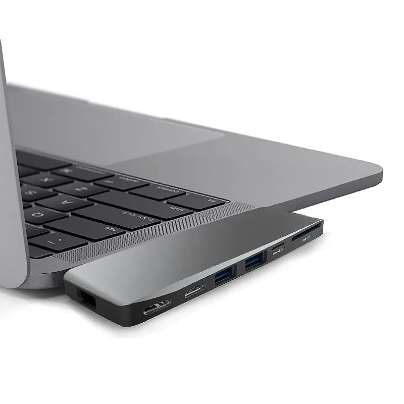 8-in-1 USB-C conversion hub with dual plugs for MacBook Pro laptops showing eight output ports