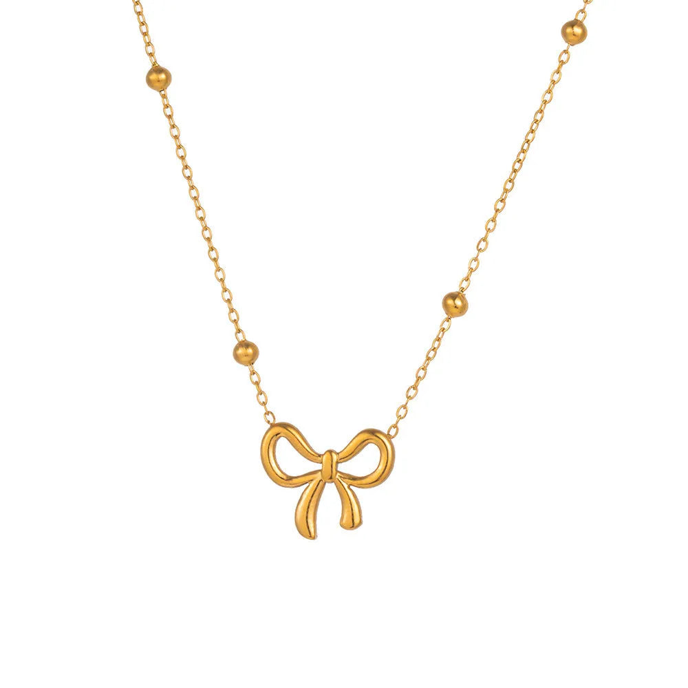 Gold bow necklace on titanium steel cross chain with adjustable 41-50cm length