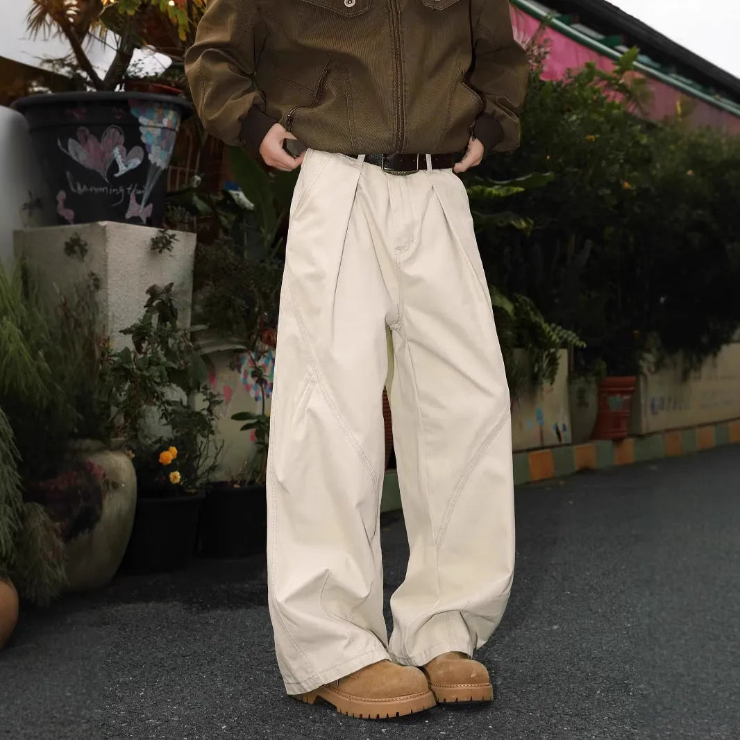 Men's pleated straight leg trousers in stripe patterns showing loose fit and micro elastic fabric