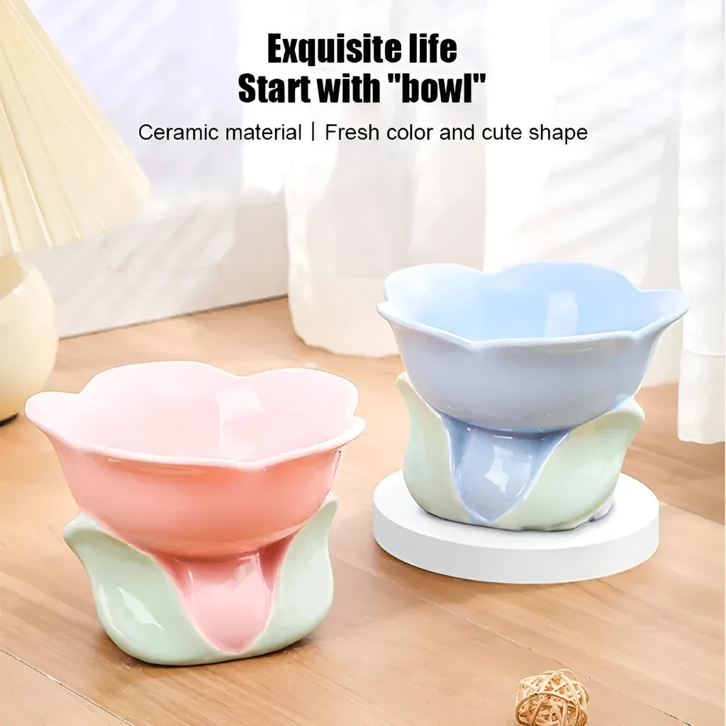 Blue ceramic raised pet bowl with floral pattern and non-slip base for cats or small dogs.