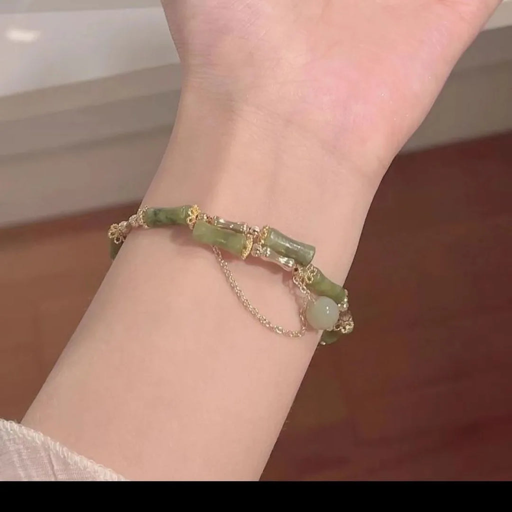 Women's bamboo bead bracelet with coloured glaze detailing in plum wine colour C208