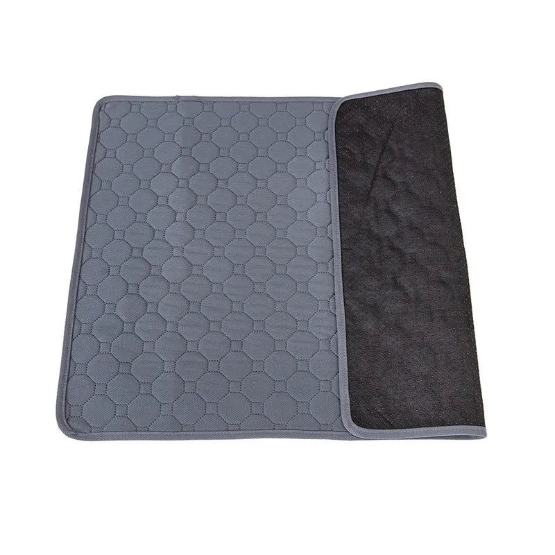 Washable dog pee pads in grey and tan colours showing multi-layer construction and triple-stitch binding