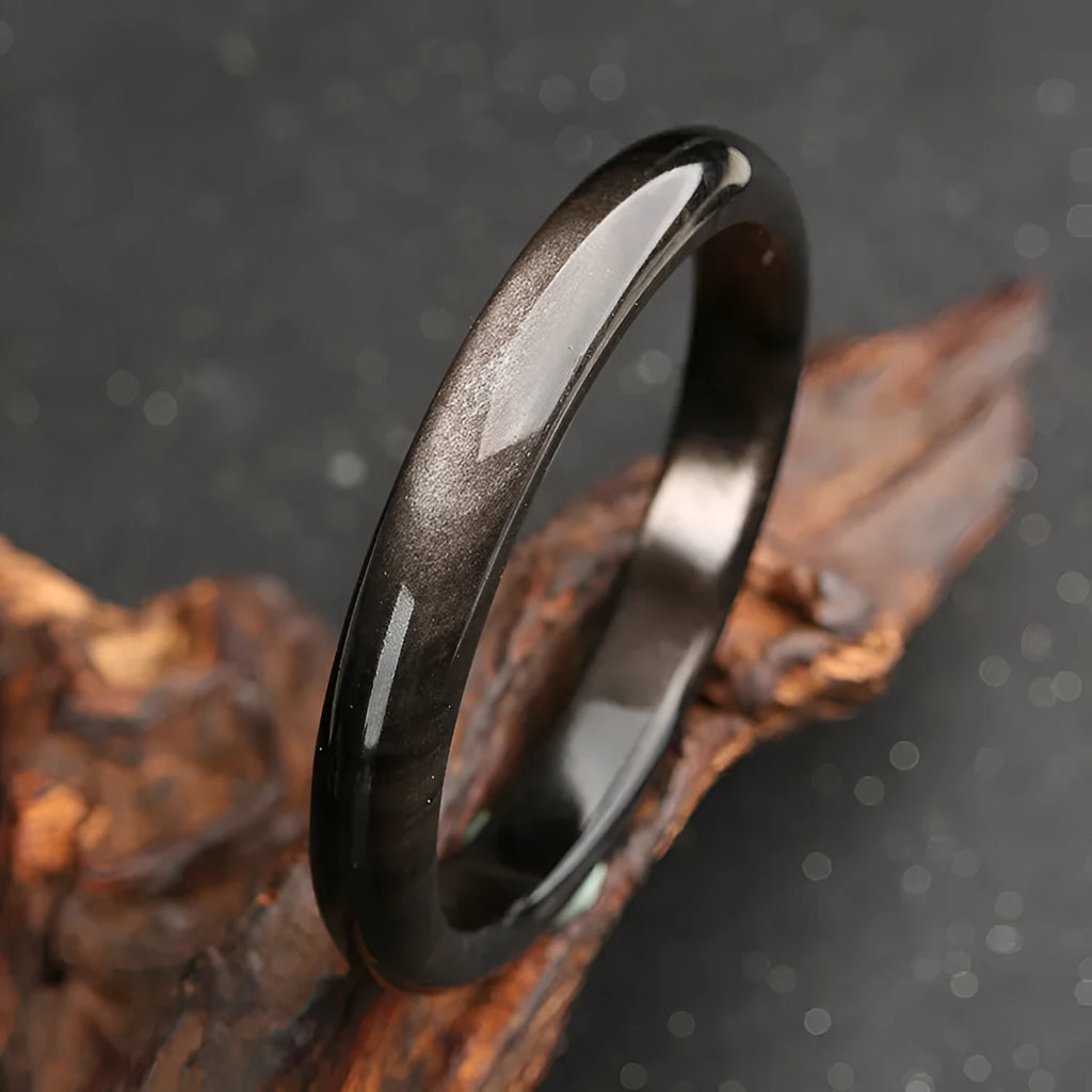 Natural silver stone cat's eye bracelet with geometric patterns on an alloy band.