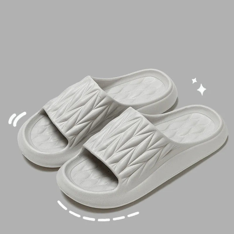 Leaf texture patterned EVA foam slippers for indoor household use, shown in multiple colours.