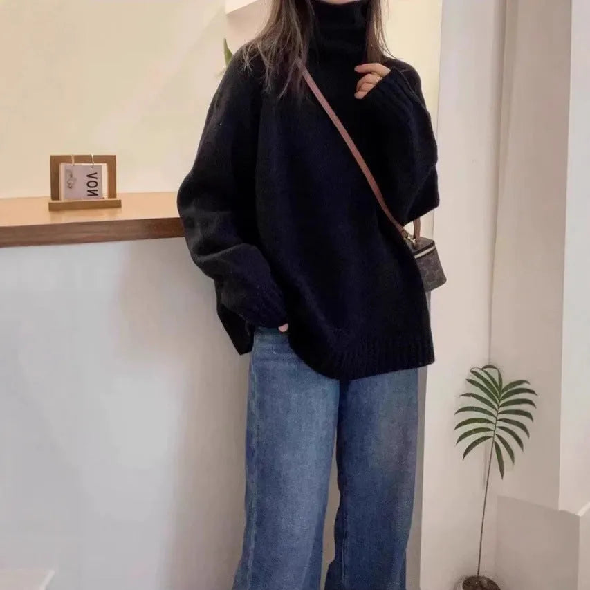 Women's loose turtleneck sweater with thick curling pile collar in solid colour