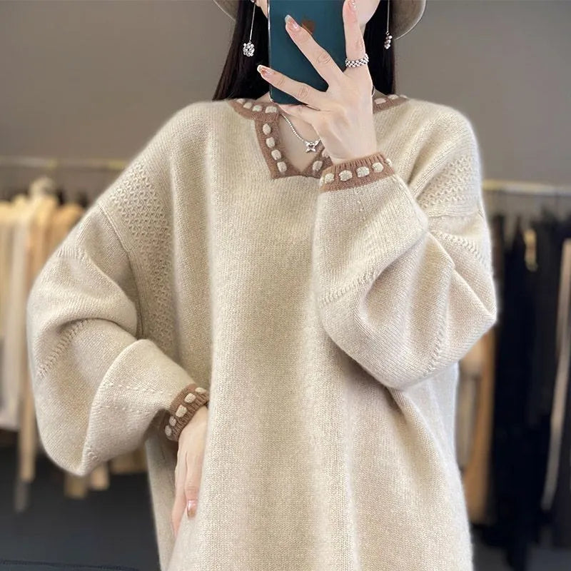 Camel coloured women's V-neck viscose pullover sweater with long sleeves on a hanger.