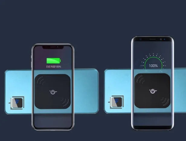 Silver portable power bank with LCD display showing battery percentage, placed next to a smartphone.