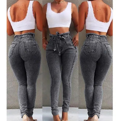 Pair of light blue jeans with a fringed raw hem on a mannequin.