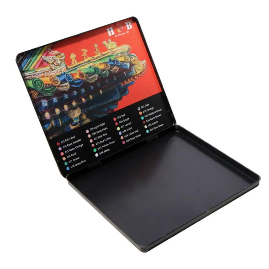 Water-soluble coloured pencil set with 24 colours, a brush, and a metal box open to show contents.