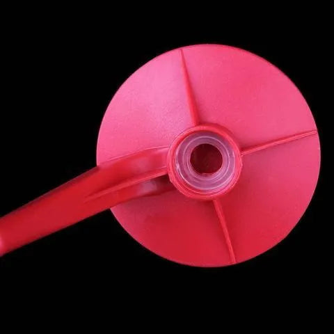 Red plastic Magic Tap soda dispenser attachment for 2-litre bottles