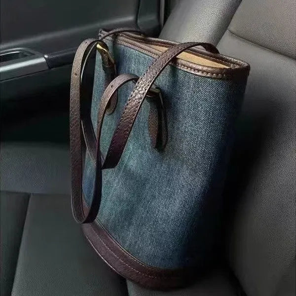 Denim patchwork handbag showing bucket shape with one-shoulder strap and patchwork detailing