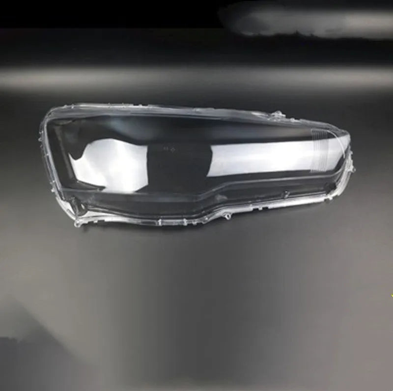 Transparent plastic headlight housing cover measuring 50mm by 30mm by 20mm