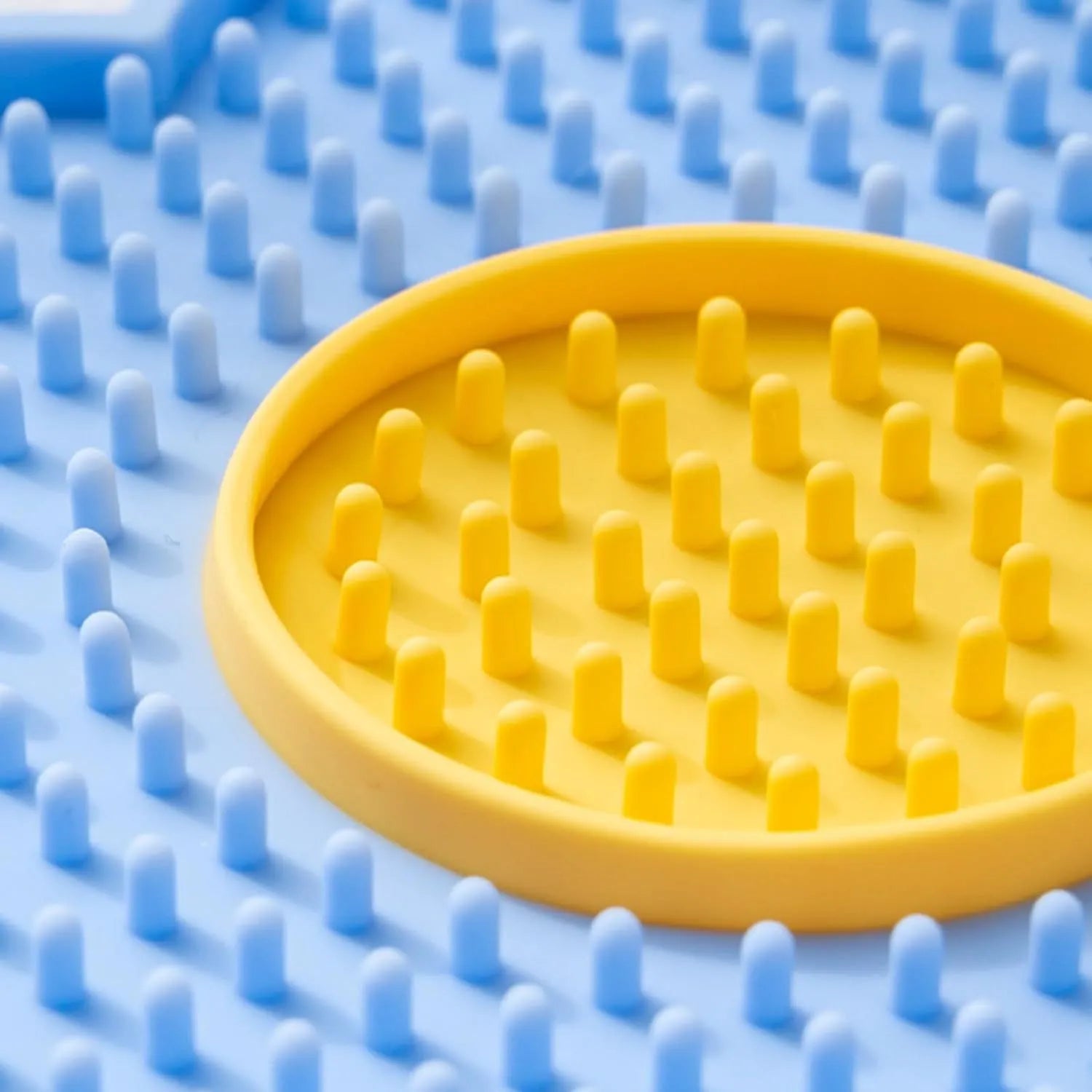 Flower-shaped silicone pet lick mat with suction cups in blue, grey, pink, purple, or red
