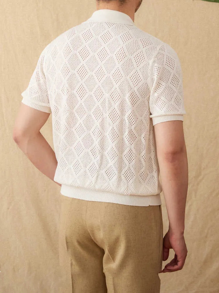 Light brown cotton short sleeve cardigan with lapel collar and front zipper on a hanger.