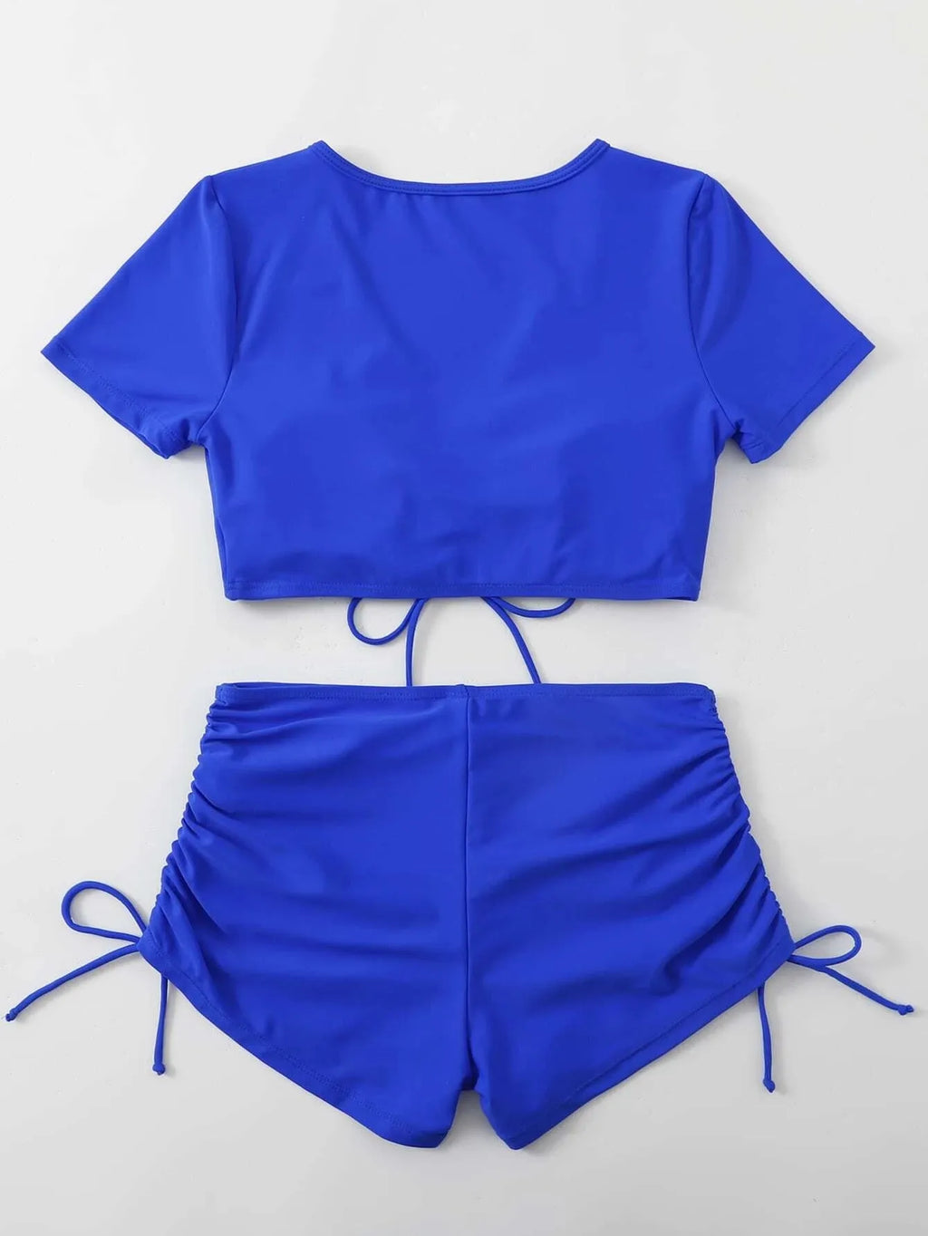 Women's dark green two-piece swimsuit with lace-up front and matching shorts.