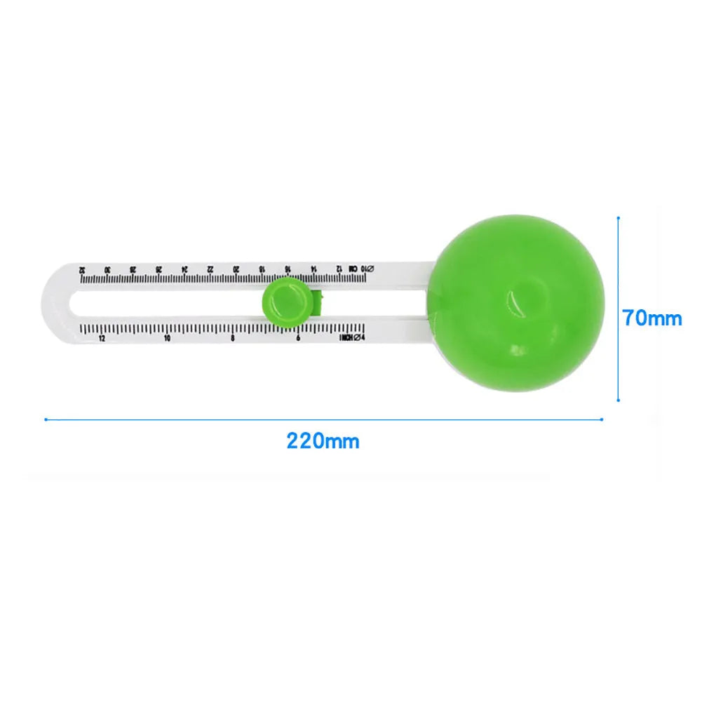 Orange and green plastic round paper cutter for A3 sheets on a table.