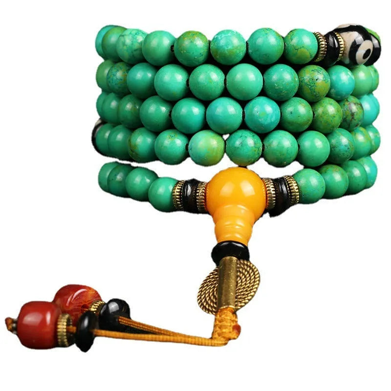 Natural turquoise bracelet with 108 polished 8mm round beads showing raw ore texture