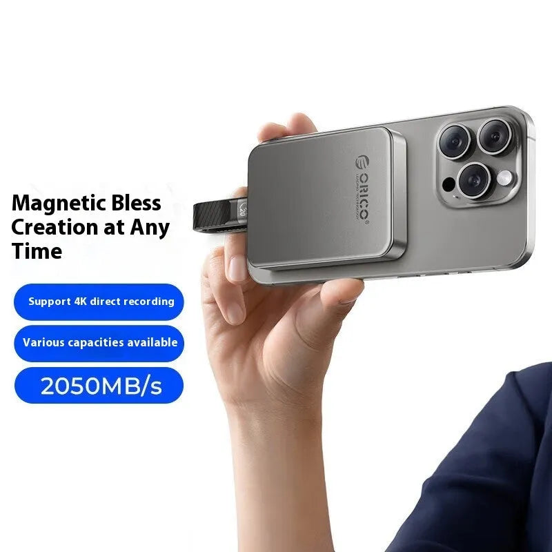 Grey magnetic mobile solid-state drive with suction ring attachment and ultra-thin design