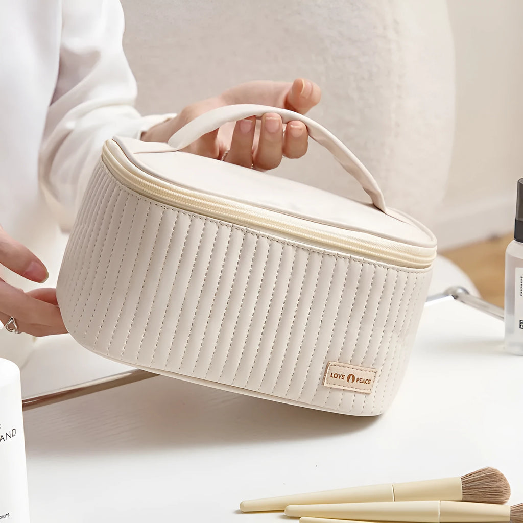 Open-top women's makeup bag in light blue PU leather with a solid colour design.
