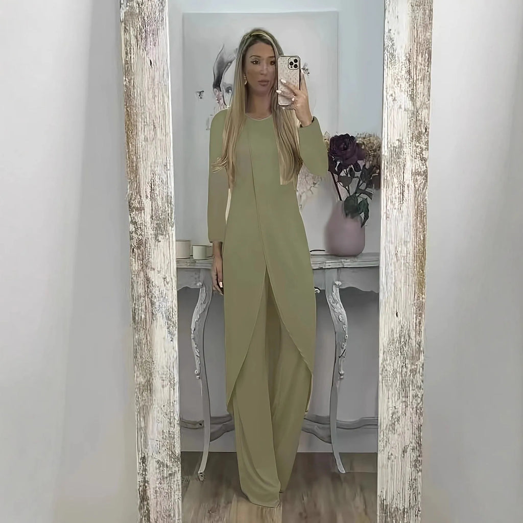Casual long sleeve top and trousers lounge set in black, shown on a hanger