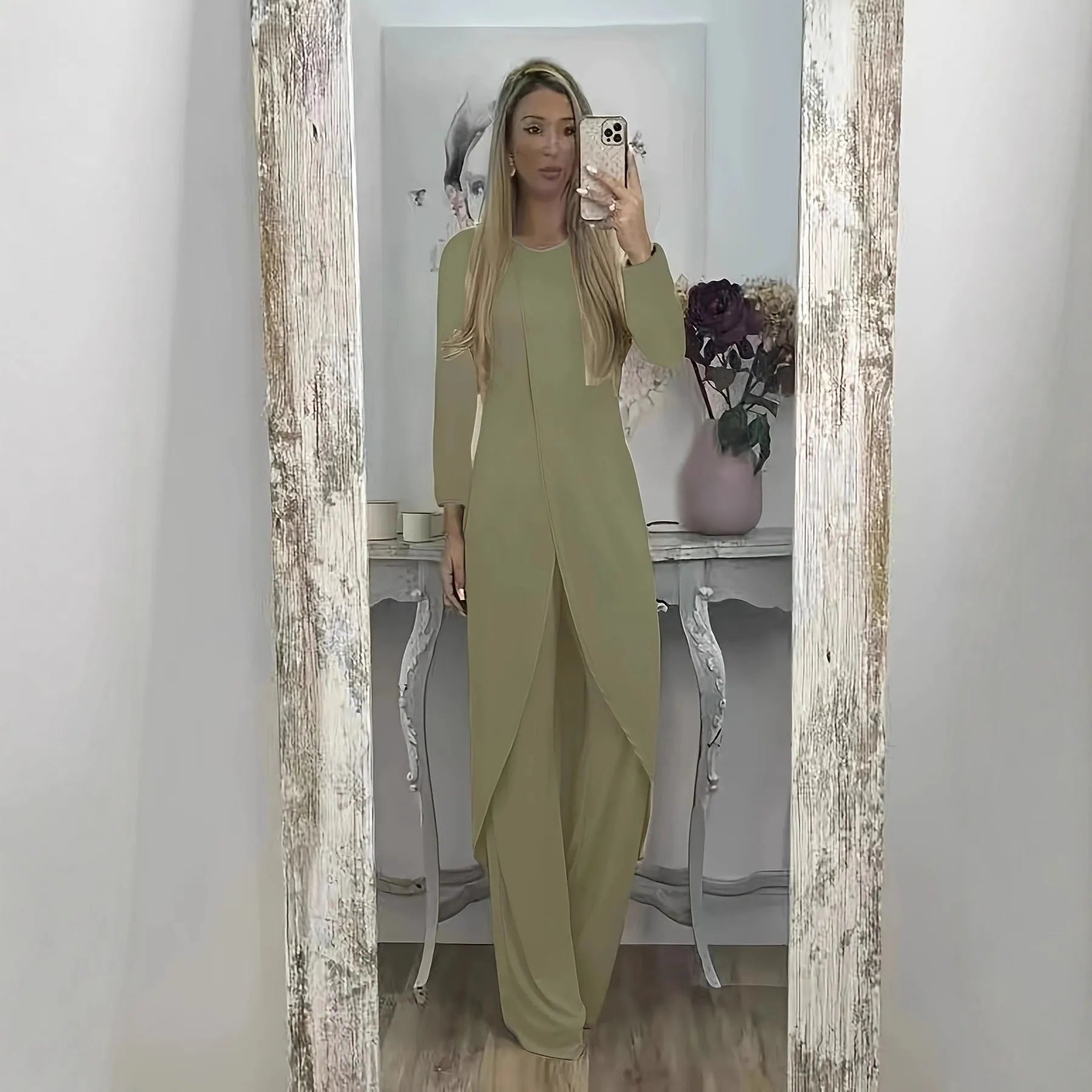 Casual long sleeve top and trousers lounge set in black, shown on a hanger