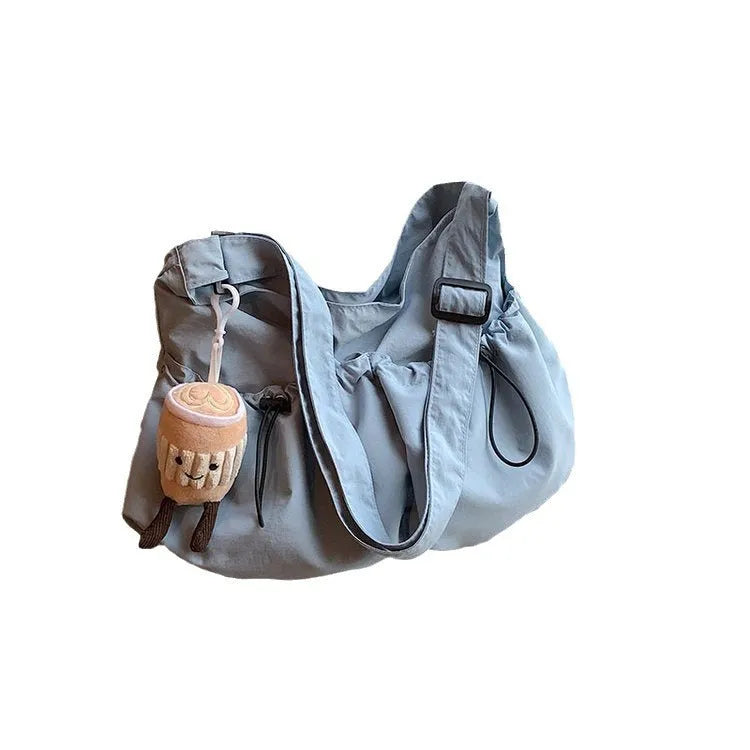 Ultra-light pleated crossbody student cloth bag in beige with split pocket and strap