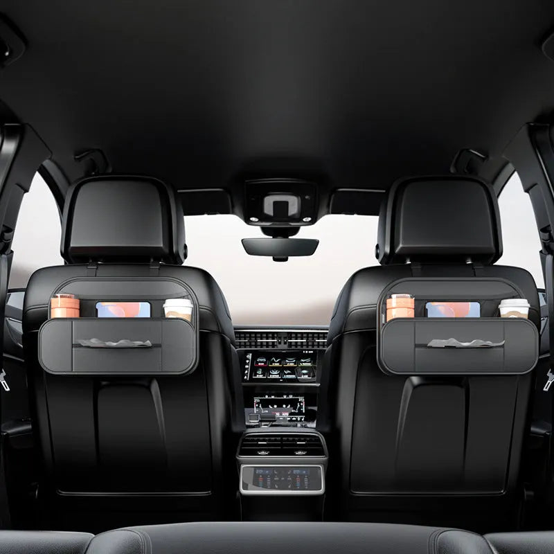 Black leather car seat rear storage bag attached to a vehicle seat, showing its storage box shape.
