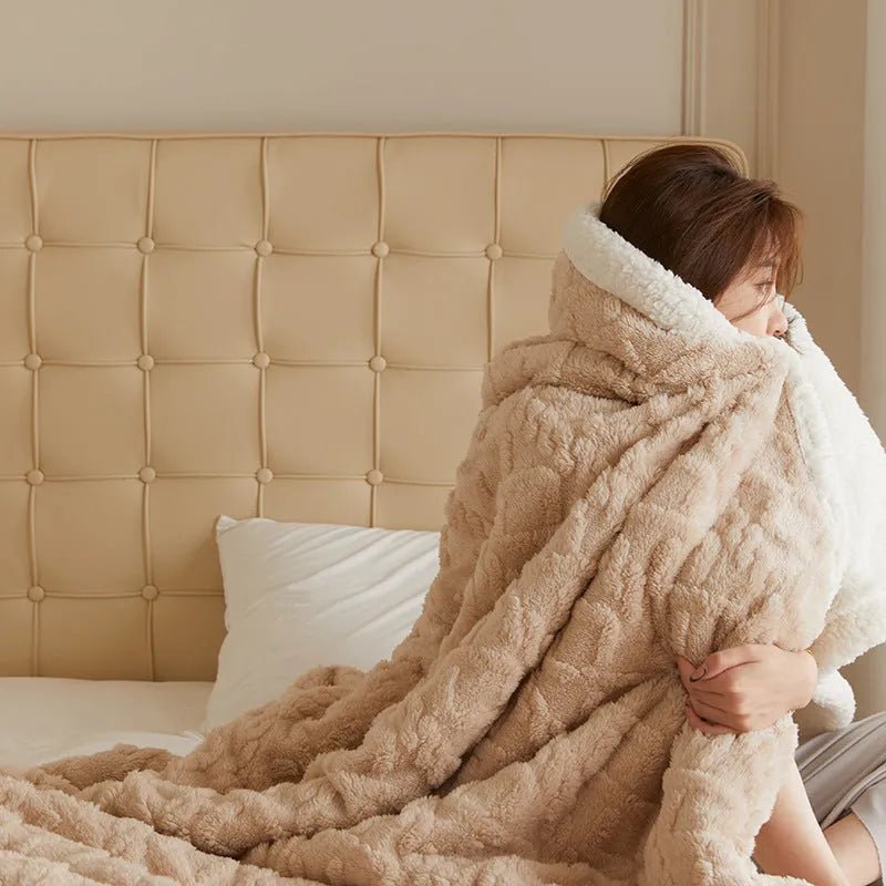 Polyester thermal flannel blanket in beige colour, folded to show texture, for winter bed use.