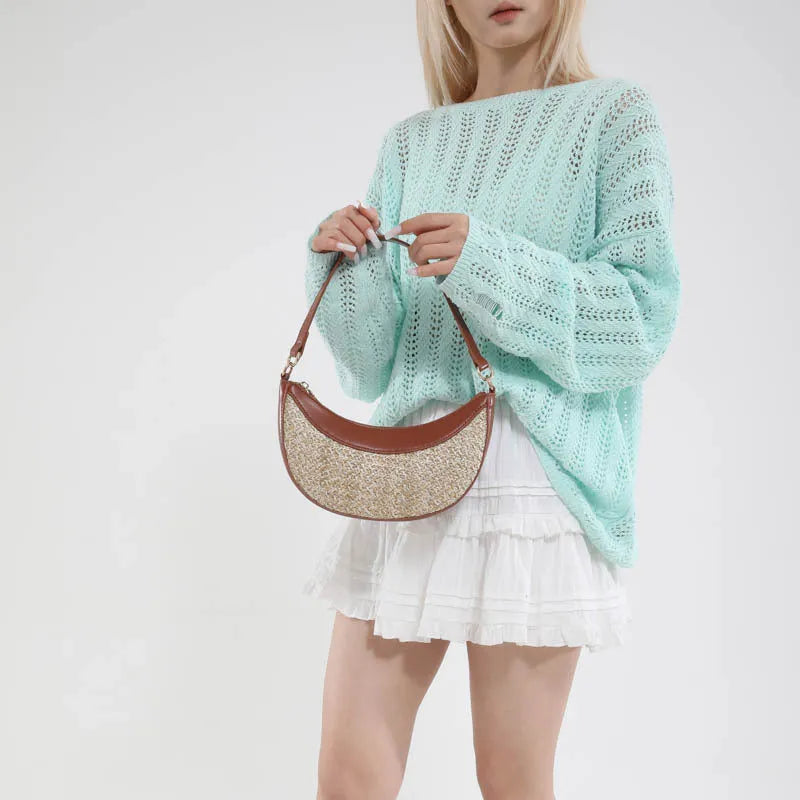 Women's straw crossbody bag with dumpling shape, contrast stitching and single shoulder strap