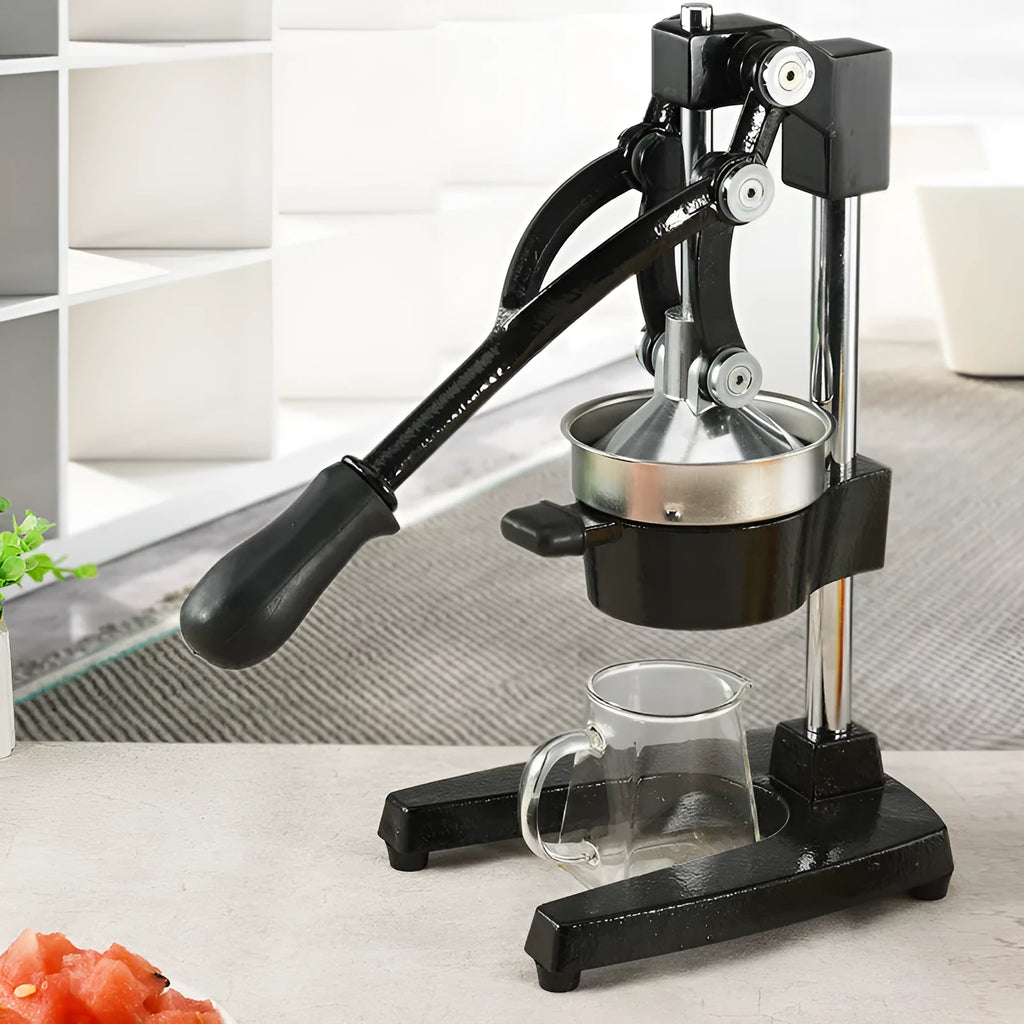 Cast iron manual citrus juicer with stainless steel strainer in black or white finish