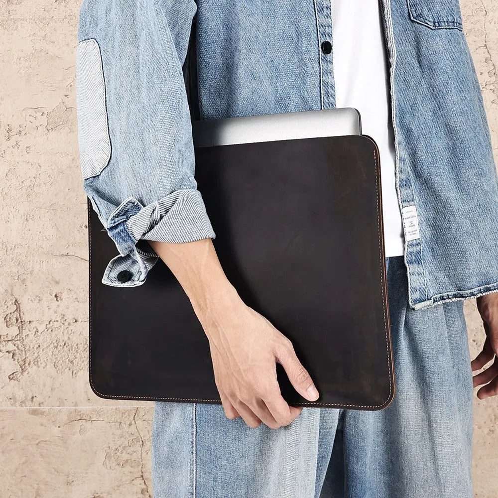 Brown crazy horse leather horizontal computer liner bag showing organisational compartments
