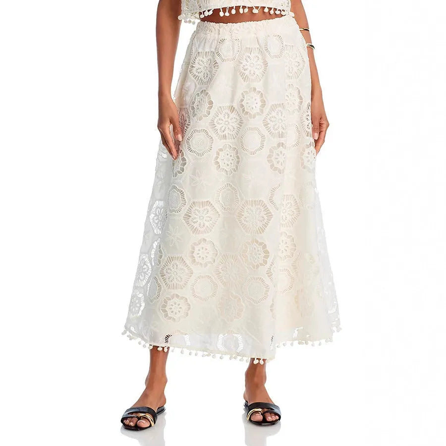 White women's sleeveless top and long skirt suit with retro embroidery details