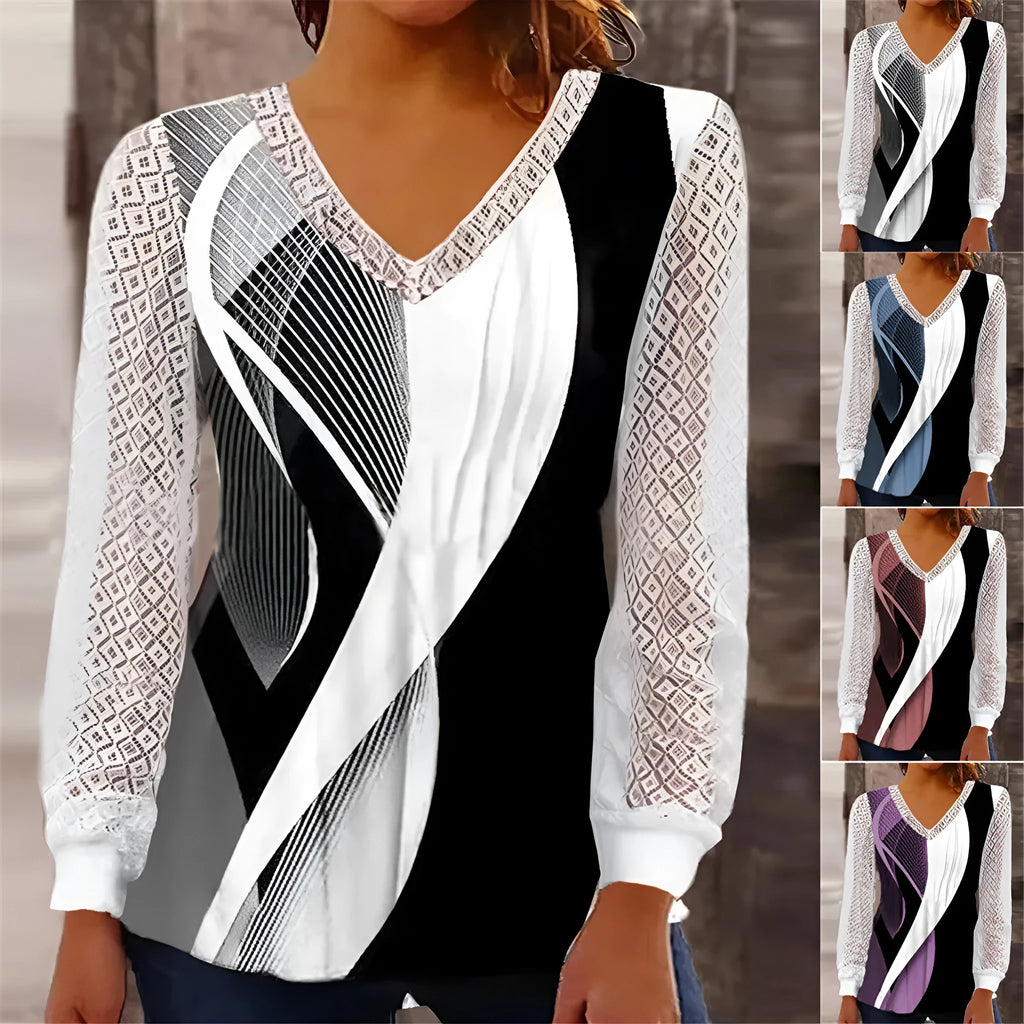 Purple loose V-neck top with lace print detail, long sleeves, on a hanger.