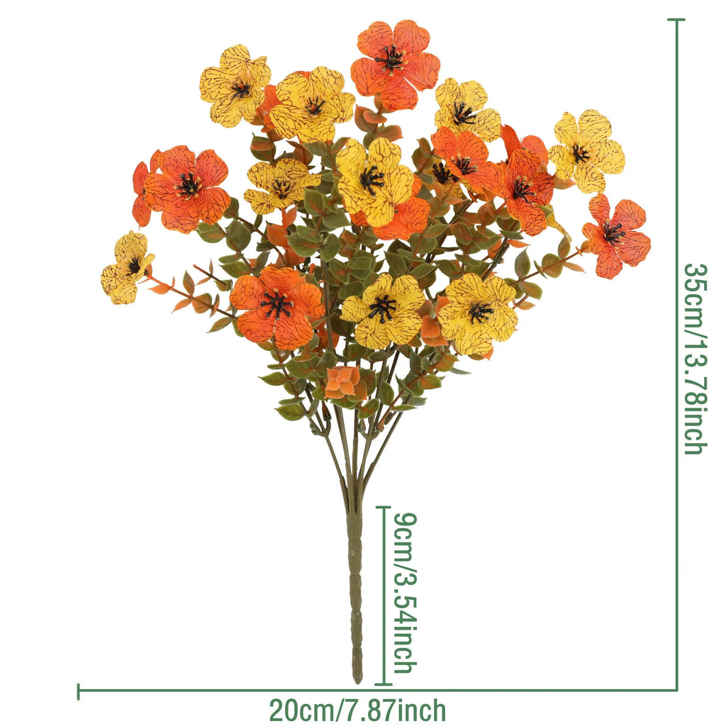 Artificial silk flower bouquet in autumn colours of red, yellow, and orange for wedding and home decoration