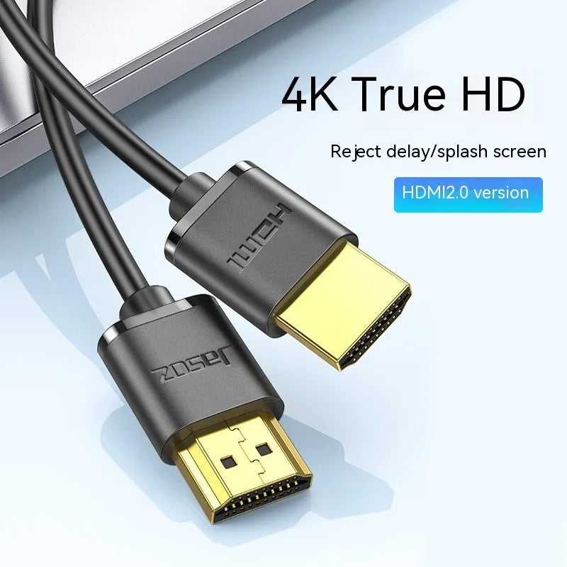 A thin, flexible black HDMI cable with gold-plated connectors on a white background.