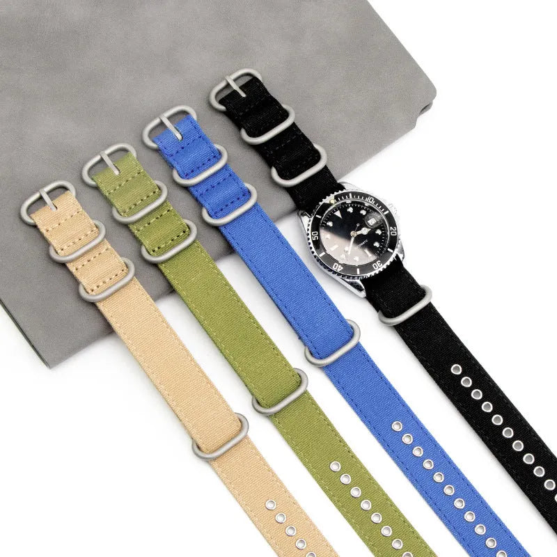 Canvas nylon thickened watch band with silver buckle in army green colour on a white background showing weave texture