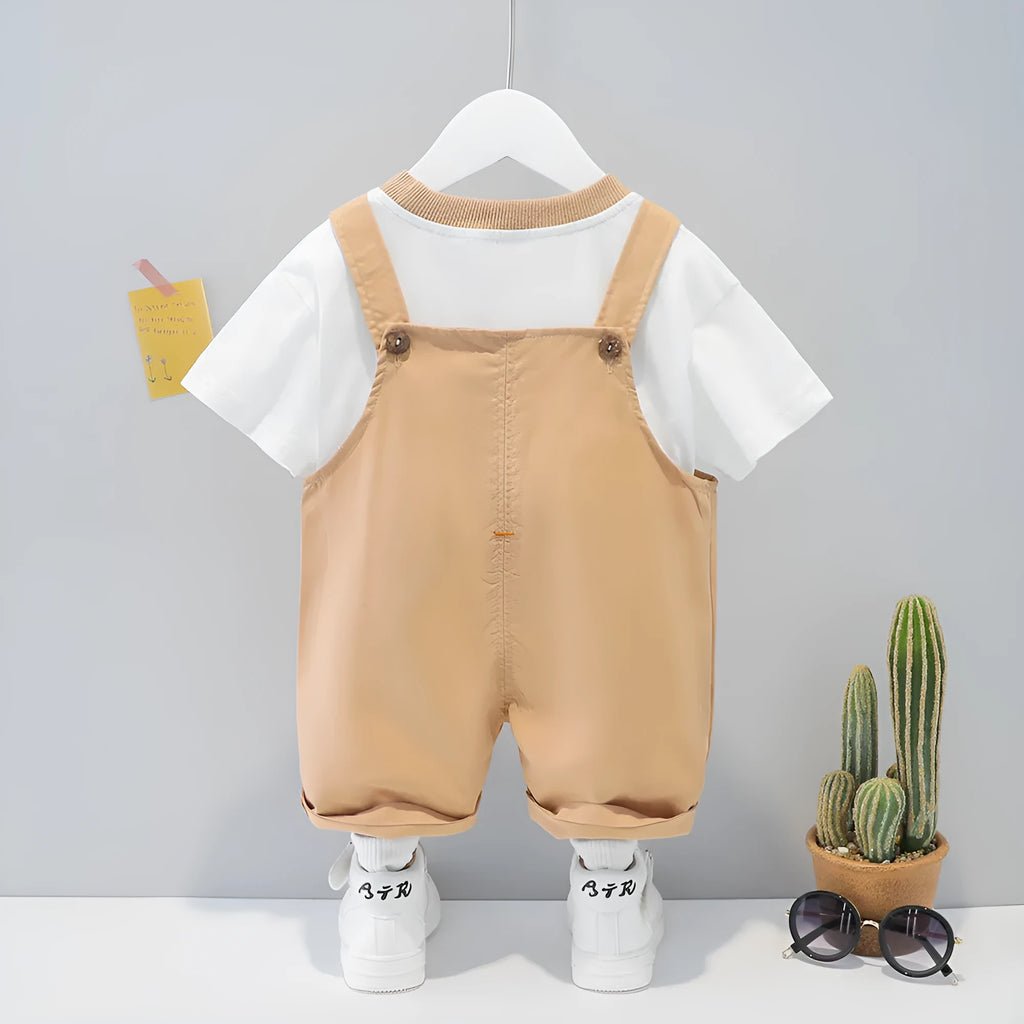 Yellow baby short-sleeved cotton overalls with cartoon print, adjustable straps, and an openable front.