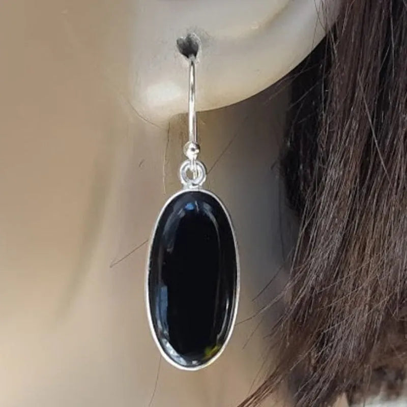 Women's oval black agate pendant earrings with geometric Chinese design on silver-style alloy
