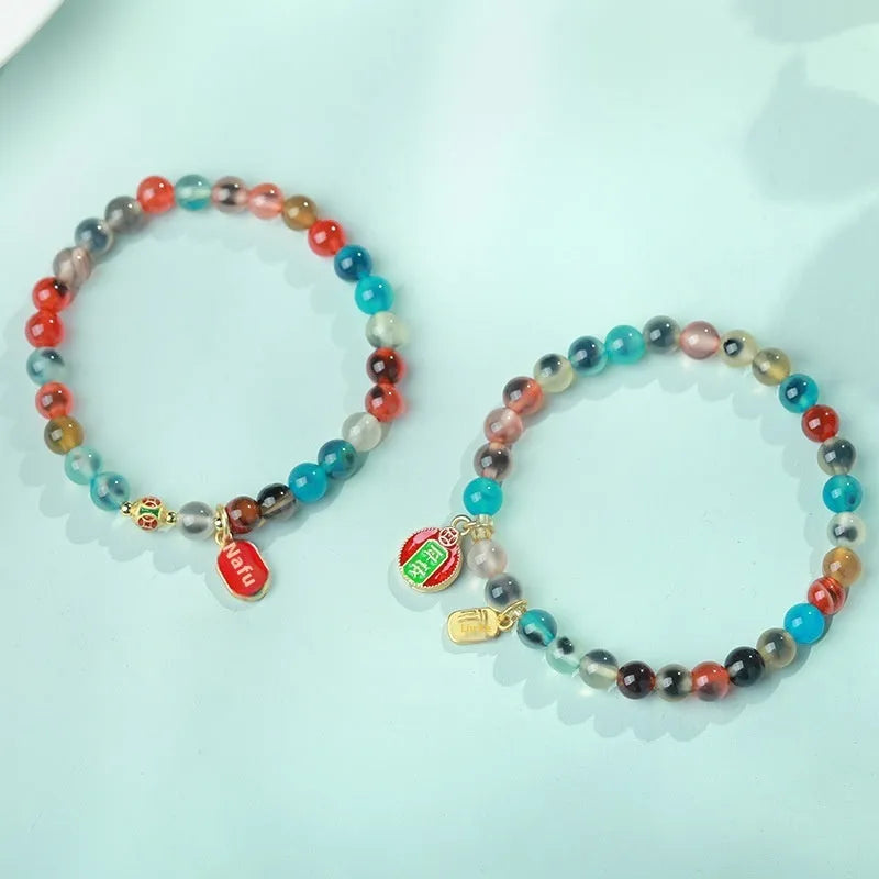 Women's agate bracelet with natural colourful sugar heart design and copper coin snake detailing