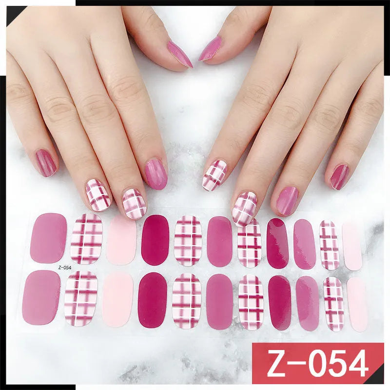 Korean nail sticker set showing 22 decals with cartoon, floral, and bow patterns alongside a nail file.