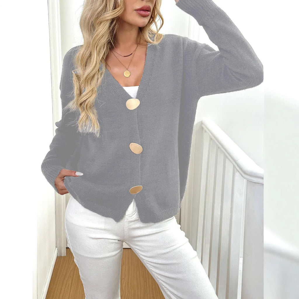 A gray women's long sleeve deer plush sweater coat with princess sleeves on a hanger.