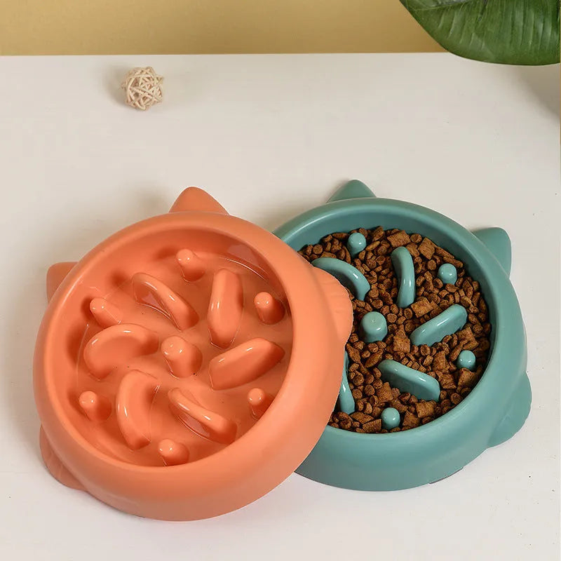 Green bone-shaped slow feeder bowl for dogs with raised interior ridges