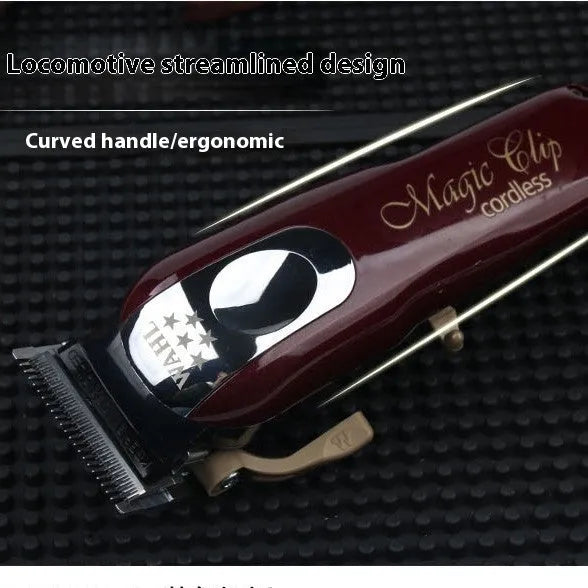 Charging hair clippers set with multiple plug adapters on a table.